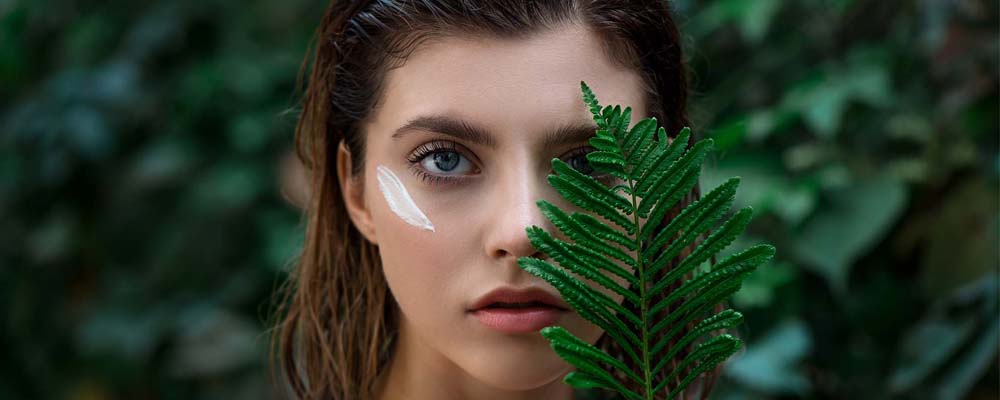 i-Cann Lifestyle model with a leaf covering face as a connotation of natural products with the origins of product range being all natural